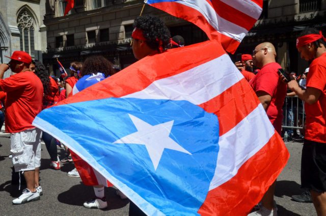 One NYDIS Marcher Wrapped Himself in "La Bandera Bonita", The Beautiful Flag